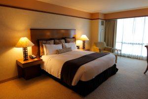 Hotel bedroom with warm lighting